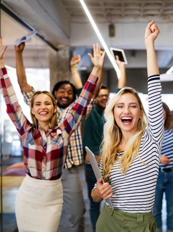 Team celebrating together in an office