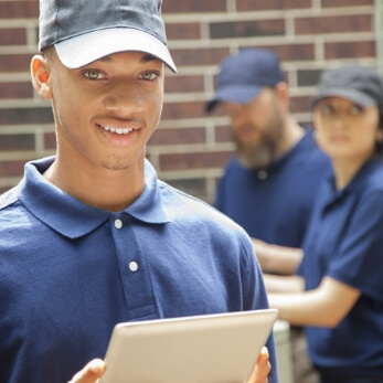 Property operations team member holding a tablet